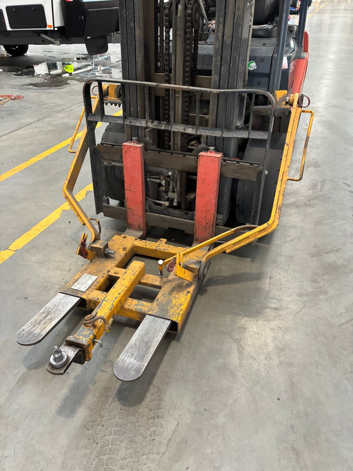 Forklift attachment in warehouse